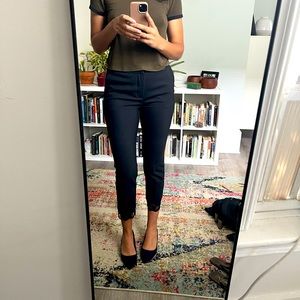 Black Zara dress trousers with tapered legs.